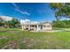 House exterior featuring covered patio and spacious yard at 5144 Washington St, Lake Wales, FL 33859