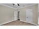 Spacious bedroom with neutral walls, carpet, and two doors at 1127 N Stella Ave, Lakeland, FL 33805