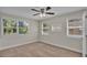 Bright bedroom with neutral walls, carpet, and multiple windows at 1127 N Stella Ave, Lakeland, FL 33805