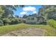 Spacious backyard with grassy area and patio at 1127 N Stella Ave, Lakeland, FL 33805