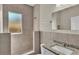 Updated bathroom with granite countertop and walk-in shower at 1127 N Stella Ave, Lakeland, FL 33805