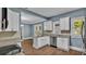 Modern kitchen with white cabinets and granite countertops at 1127 N Stella Ave, Lakeland, FL 33805