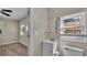 Small bathroom with vanity, toilet, and window at 1127 N Stella Ave, Lakeland, FL 33805