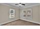 Well-lit bedroom with neutral walls, carpet, and windows at 1127 N Stella Ave, Lakeland, FL 33805