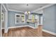 Dining area with hardwood floors and access to kitchen at 1127 N Stella Ave, Lakeland, FL 33805