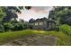 Large backyard with a grassy area and patio at 1127 N Stella Ave, Lakeland, FL 33805