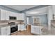 Updated kitchen with stainless steel appliances and granite countertops at 1127 N Stella Ave, Lakeland, FL 33805