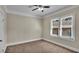 Bright bedroom with neutral walls, carpet, and double window at 1127 N Stella Ave, Lakeland, FL 33805