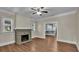 Living room with fireplace and hardwood floors at 1127 N Stella Ave, Lakeland, FL 33805