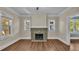 Living room with fireplace and hardwood floors at 1127 N Stella Ave, Lakeland, FL 33805