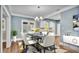 Bright dining room with hardwood floors and stylish chandelier at 1127 N Stella Ave, Lakeland, FL 33805