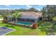 Home boasts a large pool, lush landscaping, and spacious backyard at 3933 Mammoth Grove Rd, Lake Wales, FL 33898
