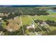 Aerial view showing house, detached garage, and expansive property at 3933 Mammoth Grove Rd, Lake Wales, FL 33898