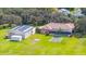 Aerial view of home, pool, detached garage, and large lot at 3933 Mammoth Grove Rd, Lake Wales, FL 33898