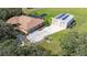 Aerial view of home with pool, detached garage, and large lot at 3933 Mammoth Grove Rd, Lake Wales, FL 33898
