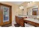 Elegant bathroom with double vanity and granite countertop at 3933 Mammoth Grove Rd, Lake Wales, FL 33898