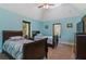 Charming bedroom with two twin beds and a ceiling fan at 3933 Mammoth Grove Rd, Lake Wales, FL 33898