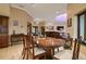 Elegant dining room with a large table and view into the living room at 3933 Mammoth Grove Rd, Lake Wales, FL 33898