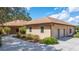 House exterior with a two-car garage and walkway at 3933 Mammoth Grove Rd, Lake Wales, FL 33898