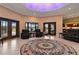 Living room with access to the pool and kitchen area at 3933 Mammoth Grove Rd, Lake Wales, FL 33898