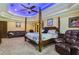 Spacious main bedroom with a post bed and seating area at 3933 Mammoth Grove Rd, Lake Wales, FL 33898