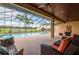 Covered patio with pool and seating at 3933 Mammoth Grove Rd, Lake Wales, FL 33898