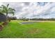 Large in-ground pool with a solar cover at 3933 Mammoth Grove Rd, Lake Wales, FL 33898