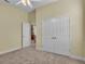 Bedroom with double doors leading to another area at 714 Whisper Woods Dr, Lakeland, FL 33813