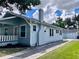 Rear view of a charming bungalow with a detached garage at 202 W Hancock St, Lakeland, FL 33803