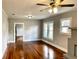 Bright living room features hardwood floors, a fireplace, and views to the kitchen at 202 W Hancock St, Lakeland, FL 33803