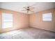 Spacious bedroom with neutral walls, ceiling fan, and plush carpeting at 3933 Strickland Ct, Lakeland, FL 33812