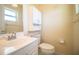 Clean bathroom with white vanity, medicine cabinet, and toilet at 3933 Strickland Ct, Lakeland, FL 33812