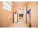 Functional laundry room with exterior access and storage at 3933 Strickland Ct, Lakeland, FL 33812