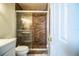 Bathroom with a shower and toilet, updated fixtures at 3933 Strickland Ct, Lakeland, FL 33812