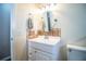 Clean bathroom with updated vanity, mirror, and tiled accents at 3933 Strickland Ct, Lakeland, FL 33812