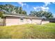 Large backyard with grassy area and a patio at 3933 Strickland Ct, Lakeland, FL 33812
