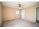 Bright bedroom with neutral walls, ceiling fan and carpet flooring at 3933 Strickland Ct, Lakeland, FL 33812