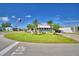 Single-wide manufactured home with screened porch and palm trees at 5002 Lodgewood Dr, Lakeland, FL 33810