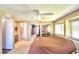 Spacious main bedroom with mirrored closet doors and ensuite bathroom at 5002 Lodgewood Dr, Lakeland, FL 33810