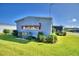 Home exterior showcasing landscaping and AC unit at 5002 Lodgewood Dr, Lakeland, FL 33810