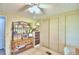 Bright bedroom with sliding door closet and ceiling fan at 5002 Lodgewood Dr, Lakeland, FL 33810