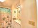 Clean bathroom with vanity, shower, and decorative accents at 5002 Lodgewood Dr, Lakeland, FL 33810