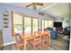 Bright dining area with table and chairs, view to living room at 5002 Lodgewood Dr, Lakeland, FL 33810