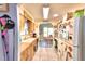 Cozy kitchen with wood cabinets and view into dining area at 5002 Lodgewood Dr, Lakeland, FL 33810