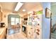 Kitchen with wood cabinets, microwave, and view of dining area at 5002 Lodgewood Dr, Lakeland, FL 33810