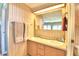 Double sink bathroom vanity with a mirrored medicine cabinet at 5002 Lodgewood Dr, Lakeland, FL 33810