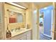 Bright bathroom with vanity, mirror and access to another room at 5002 Lodgewood Dr, Lakeland, FL 33810