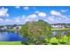 Aerial view of waterfront community with lush landscaping and homes at 5002 Lodgewood Dr, Lakeland, FL 33810