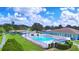 Community swimming pool with surrounding green space at 5002 Lodgewood Dr, Lakeland, FL 33810