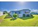 View of home's side with green lawn and white fence at 5002 Lodgewood Dr, Lakeland, FL 33810